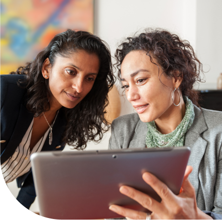 two people working on a laptop