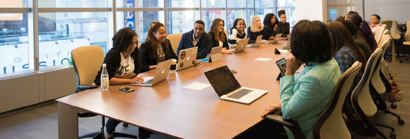 A group of people at a business meeting